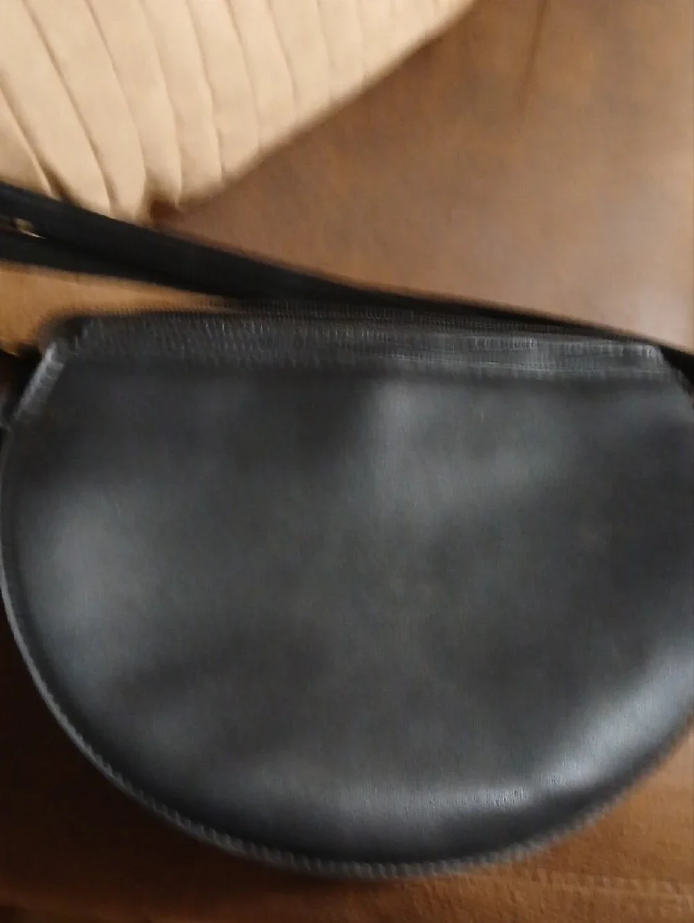 Black Semi-Circle Crossbody Bag with Gold Accent